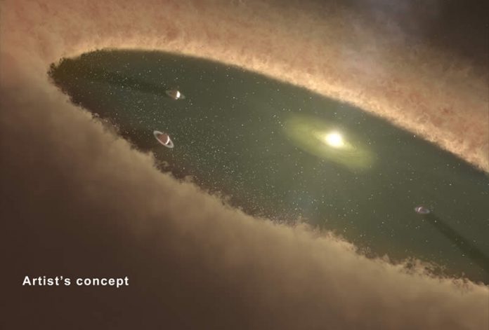 Esta concepción artística muestra planetas gigantes dando vueltas entre los cinturones de polvo. Los científicos creen que el sistema de la estrella HD 95068 puede tener una arquitectura planetaria similar a esta. Mientras que dos cinturones de polvo del sistema de estrellas son conocidos, junto con un planeta masivo, los planetas gigantes pueden estar al acecho y ser aún invisibles. Esta concepción artística muestra planetas gigantes dando vueltas entre los cinturones de polvo. Los científicos creen que el sistema de la estrella HD 95068 puede tener una arquitectura planetaria similar a esta. Mientras que dos cinturones de polvo del sistema de estrellas son conocidos, junto con un planeta masivo, los planetas gigantes pueden estar al acecho y ser aún invisibles.