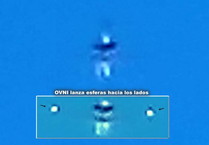 En un momento del vídeo el OVNI humanoide lanza unas esferas luminosas hacia ambos lados. En un momento del vídeo el OVNI humanoide lanza unas esferas luminosas hacia ambos lados.